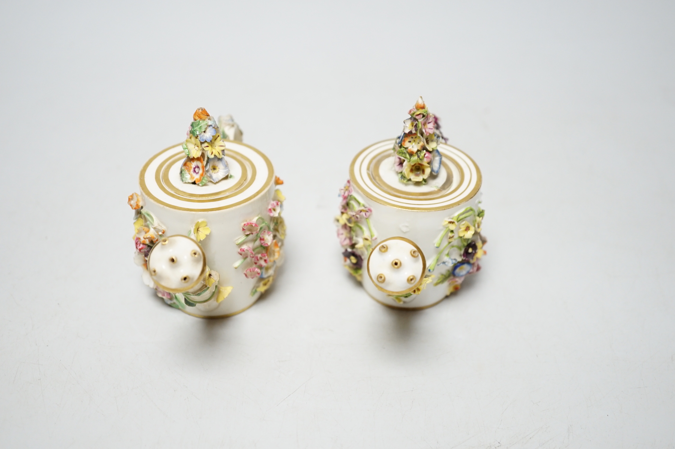 Two Derby porcelain floral encrusted miniature water sprinklers, circa 1825, 9cm high